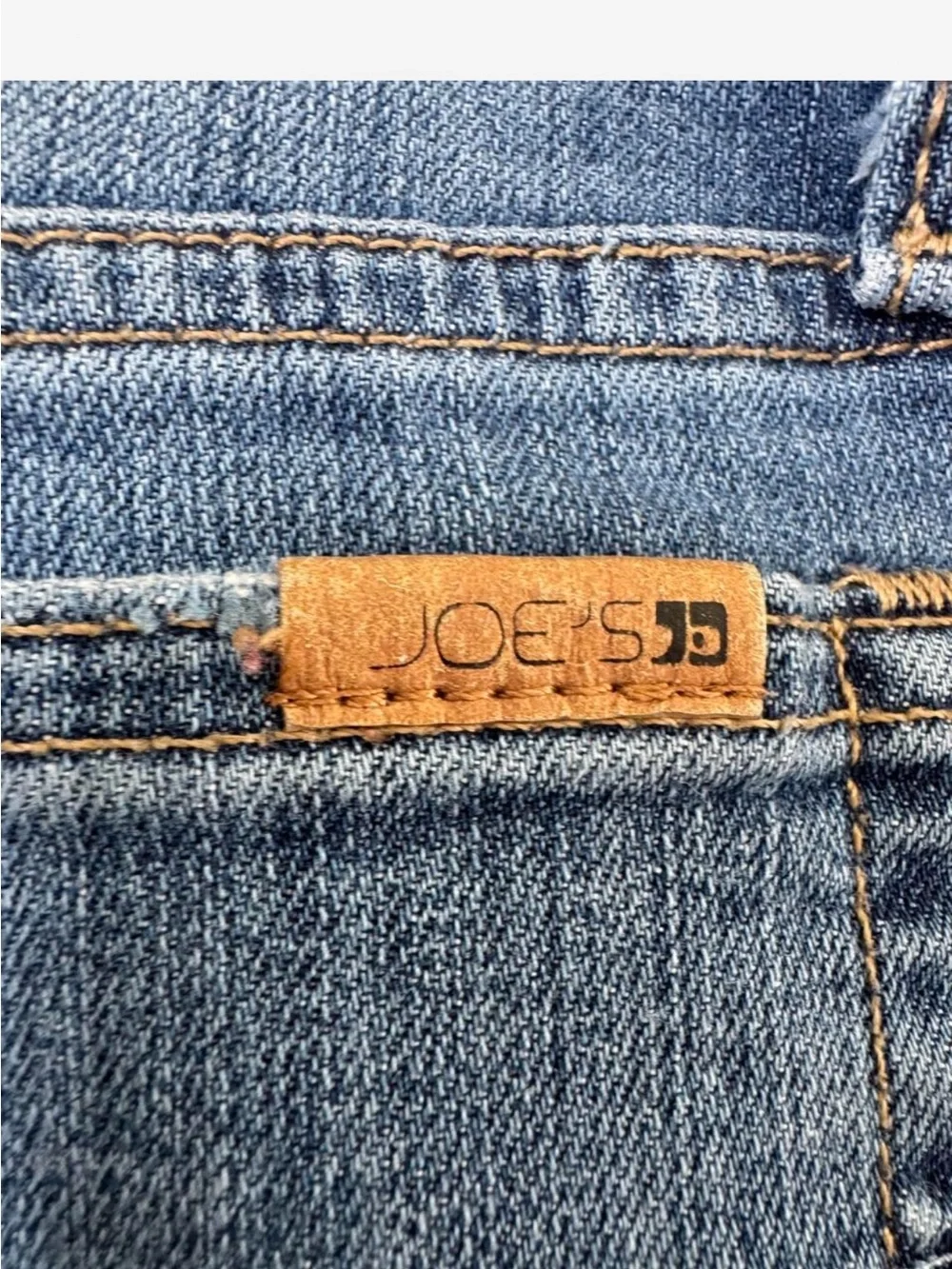 Joe’s Jeans Vintage Reserve 1971 denim shorts in a mid blue wash.